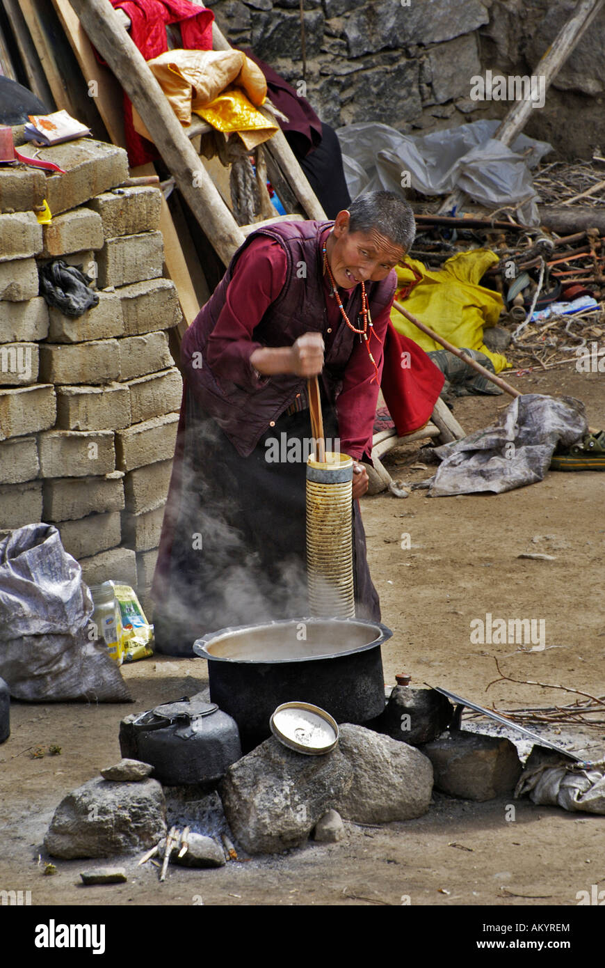 Nun at butter stamping, Chim-puk Hermitage near Tsethang close to Lhasa, Tibet, Asia Stock Photo