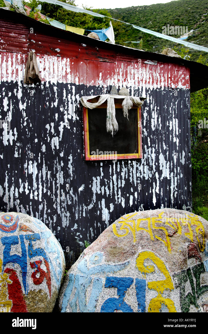 Mani stones at a sheet metal hut, Chim-puk Hermitage near Tsethang close to Lhasa, Tibet, Asia Stock Photo