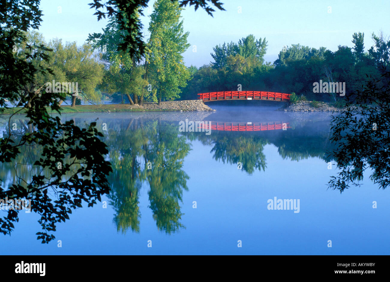Red Bridge reflected in lake Stock Photo