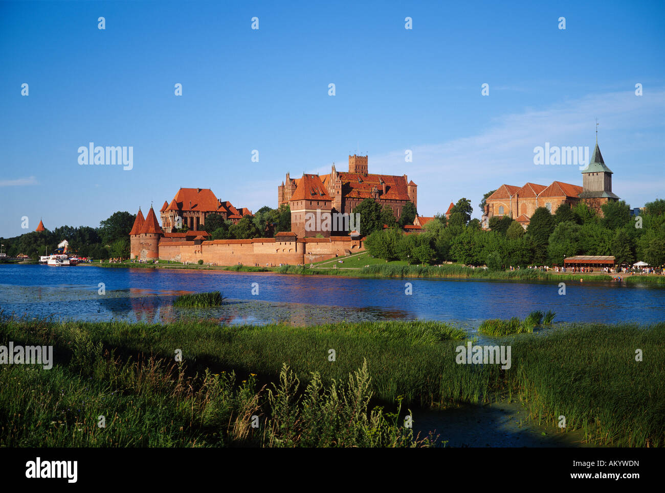 Malbork Castle (aka Mary's Castle), the ancestral seat of the Teutonic Order, is situated at the river Nogat. Stock Photo