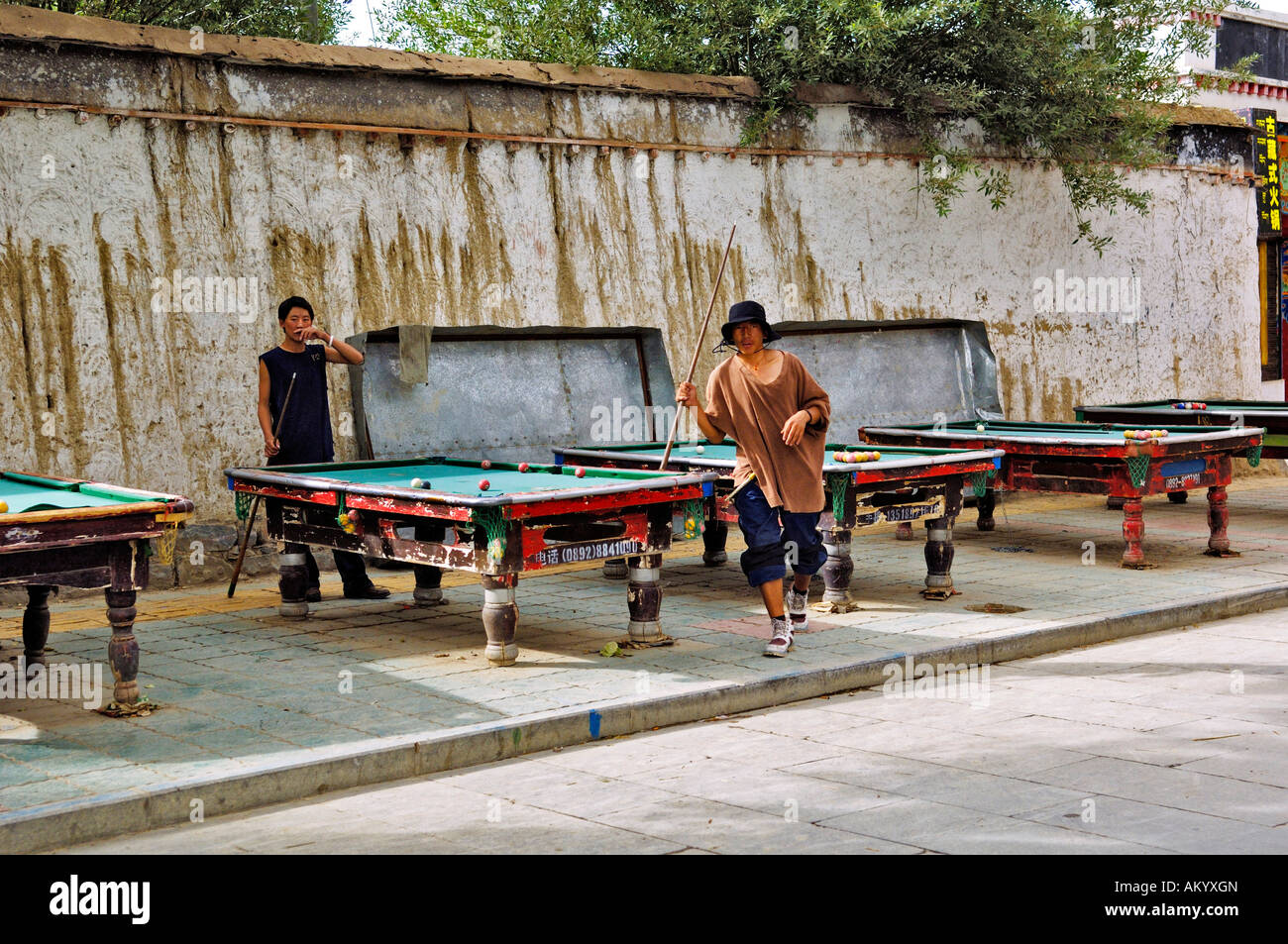 Billiards players outdoors, Shigatse, Tibet, Asia Stock Photo