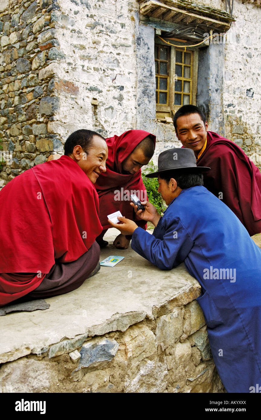 Monks with a mobile phone, monastery Tshurpu near Lhasa, Tibet, Asia Stock Photo Alamy