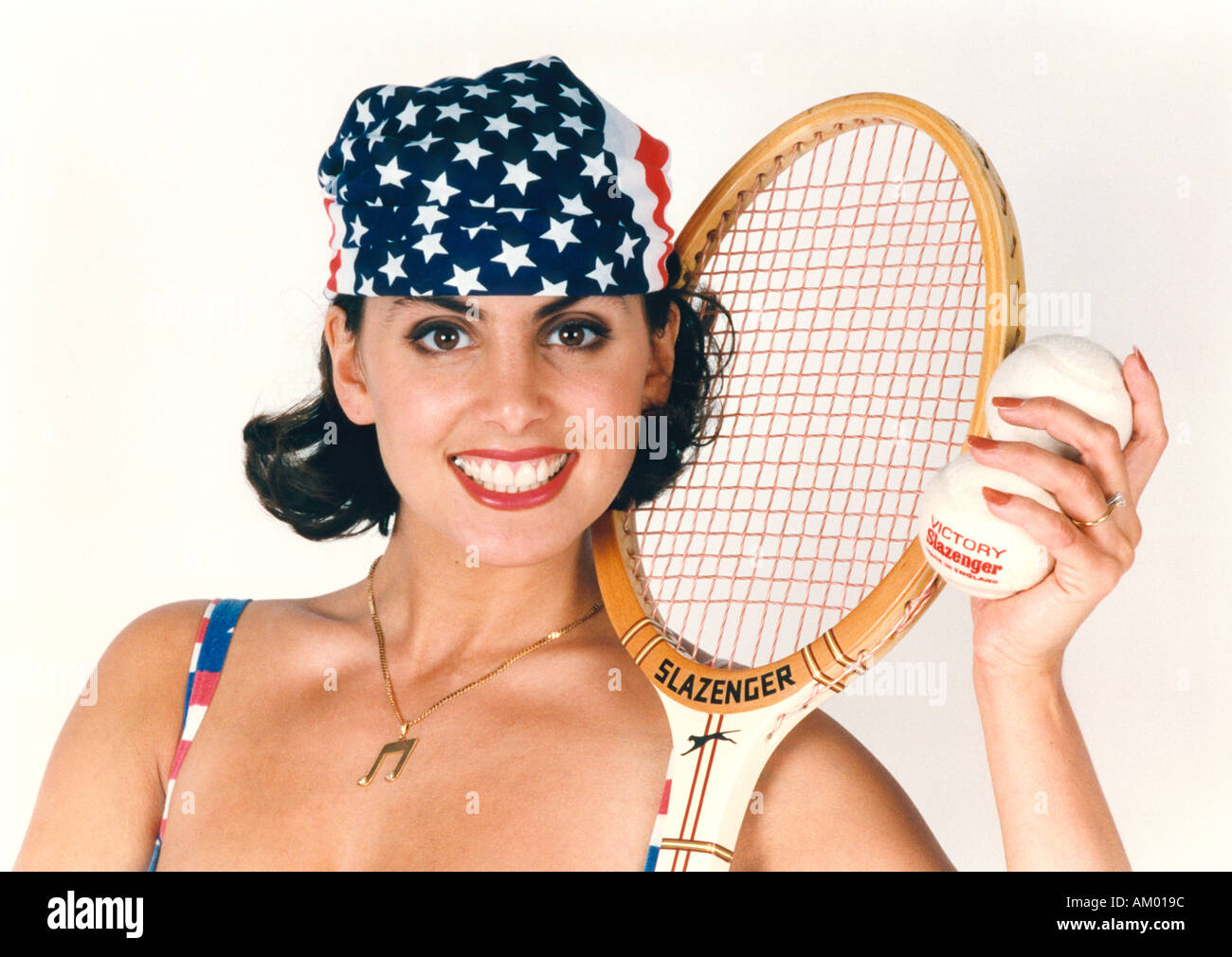 Portrait of a Girl with Tennis Racket and Ball Stock Photo
