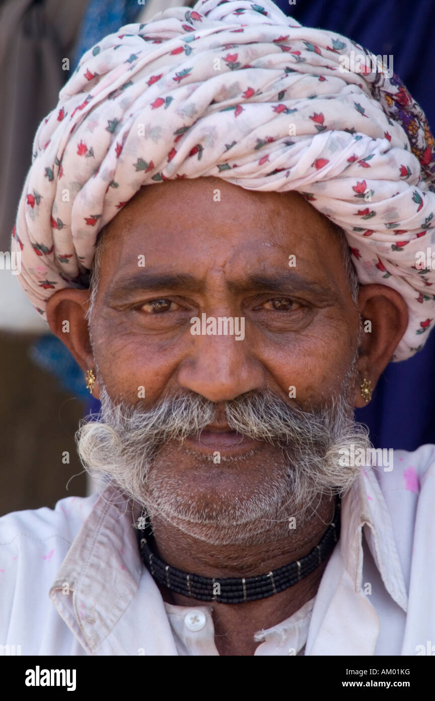 Devi, a semi-retired Rajasthani farmer from the village of Nimaj, Rajasthan, India, poses for a portrait. - Stock Image