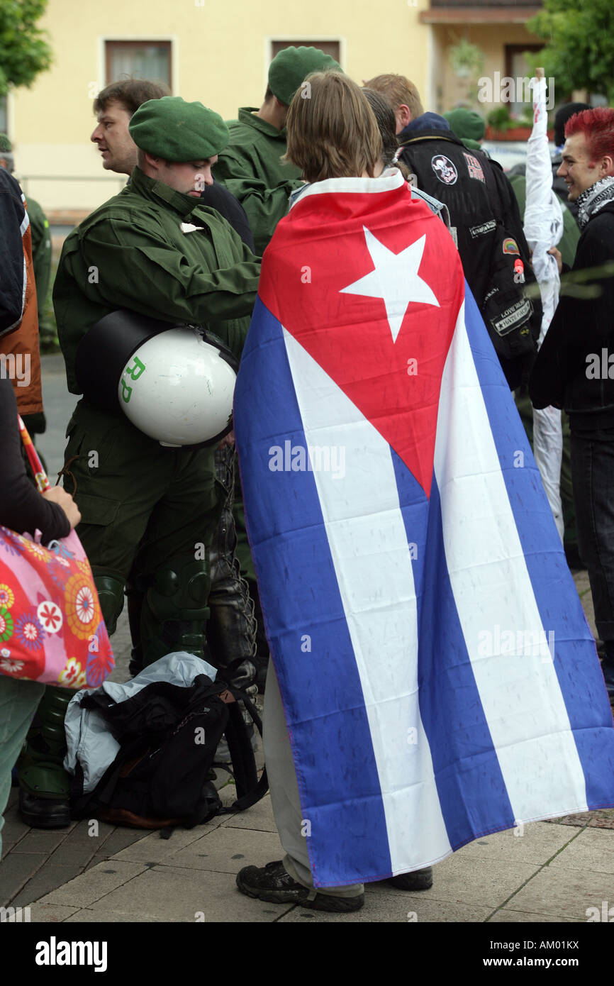 Policeman checks a demonstrator Stock Photo