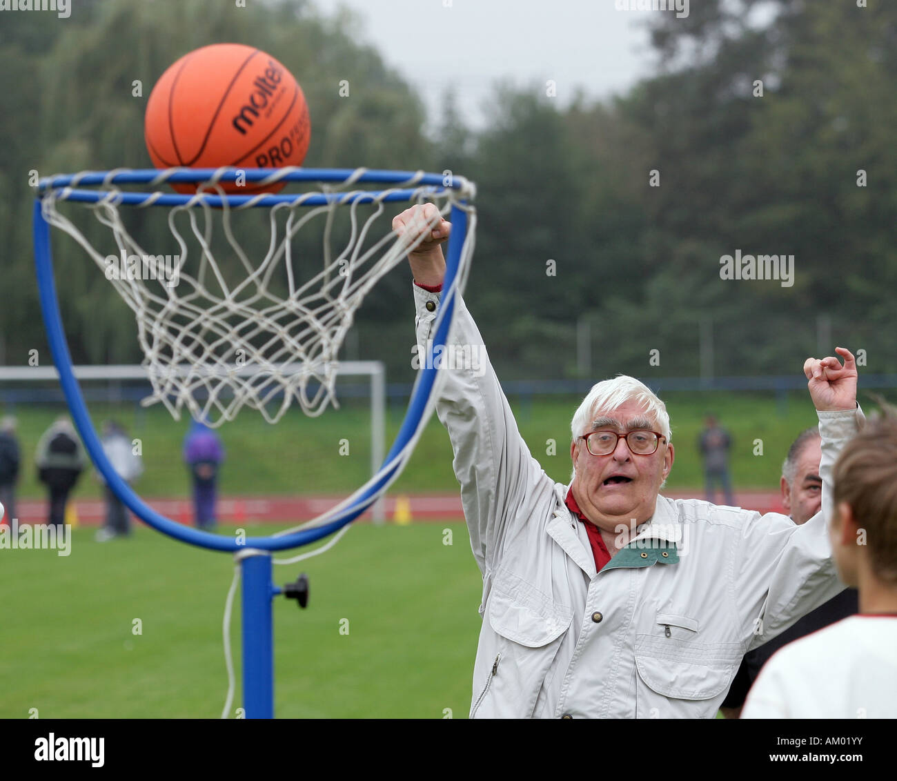 Handicapped man playing basketball Stock Photo