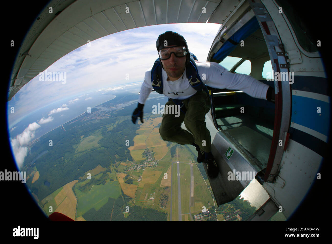 Parachutist leaving the aircraft Stock Photo