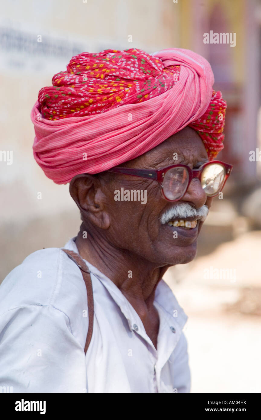 An elderly Rajasthani man gazes through thick glasses in the small village of Nimaj, Rajasthan, India. - Stock Image