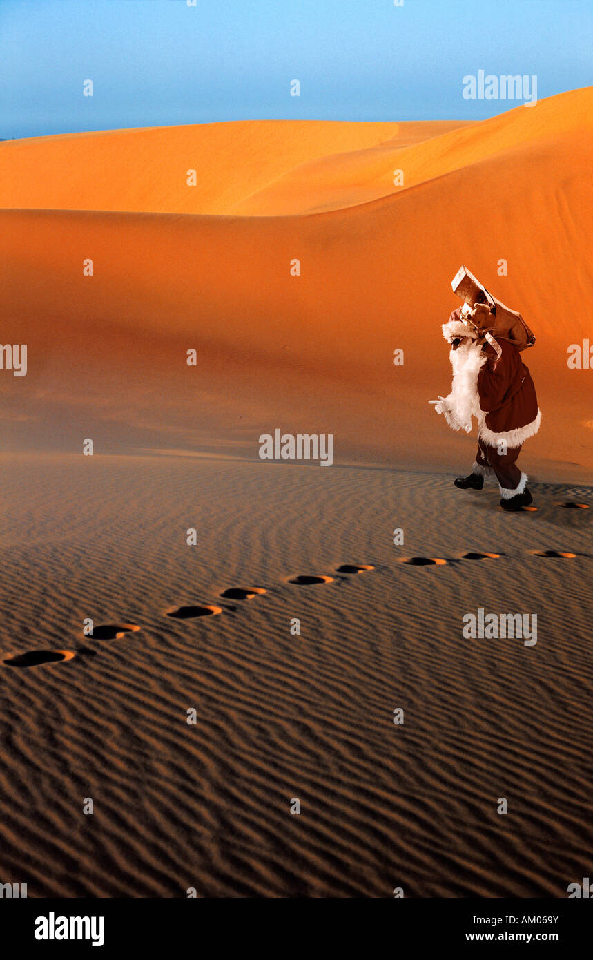 Santa Claus lost in the desert Stock Photo