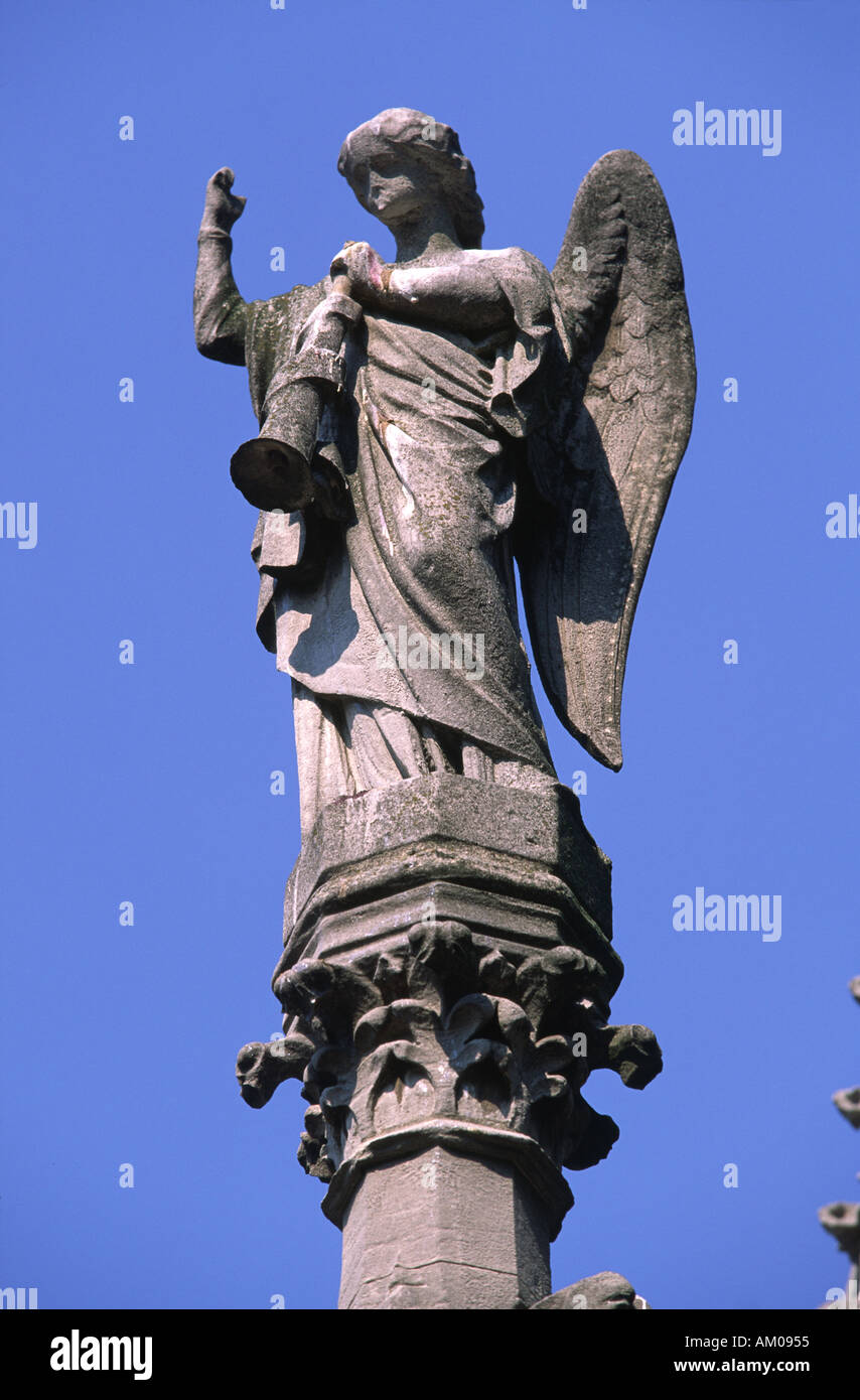 Guardian angel statue atop a mausoleum in Cimetiere de Montmartre, Paris, France. Stock Photo