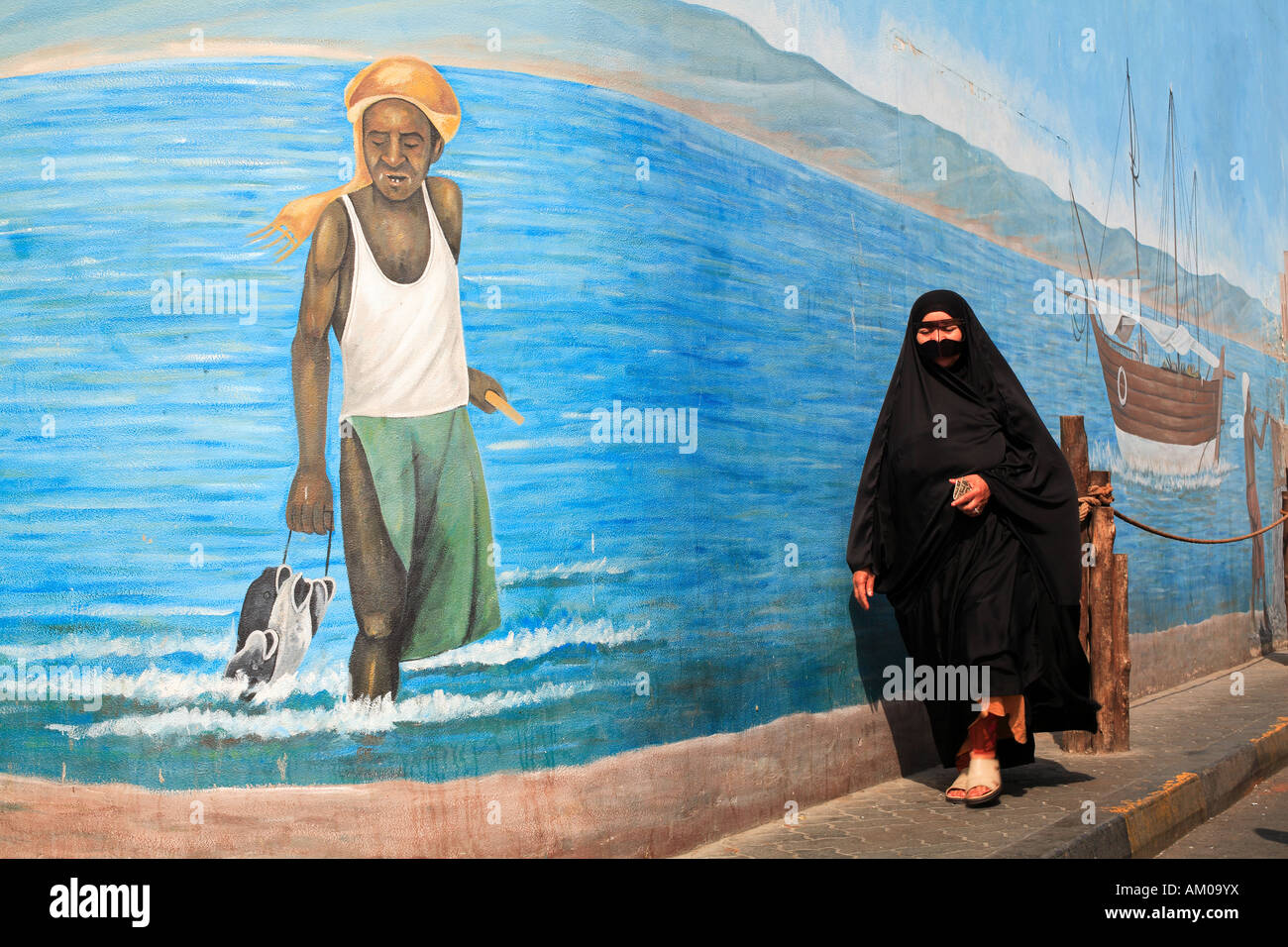 Woman walking along dubai hi-res stock photography and images - Alamy