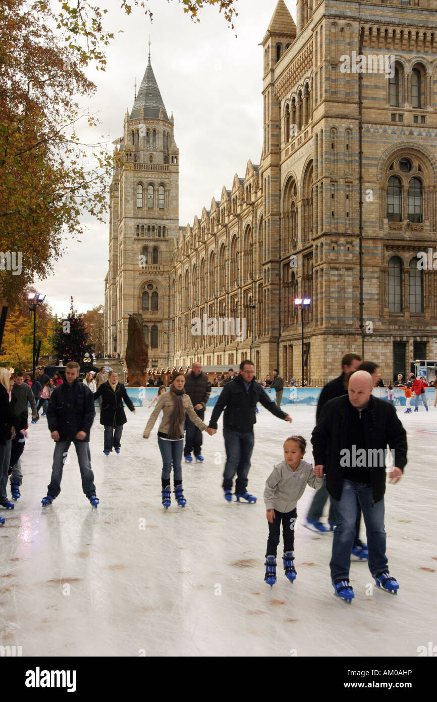 Children and adults Ice skating, Natural History Museum, London England Stock Photo