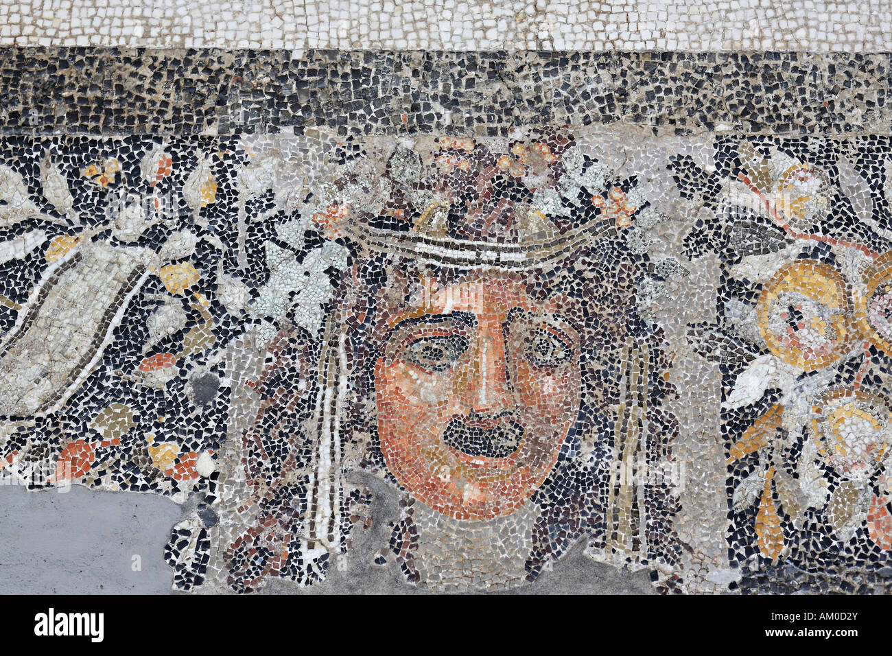 Mosaic floor showing mask of New Comedy from so called hill-house in Museum, Delos, Greece Stock Photo