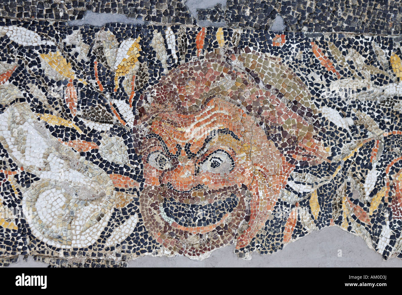 Mosaic floor showing mask of New Comedy from so called hill-house in Museum, Delos, Greece Stock Photo