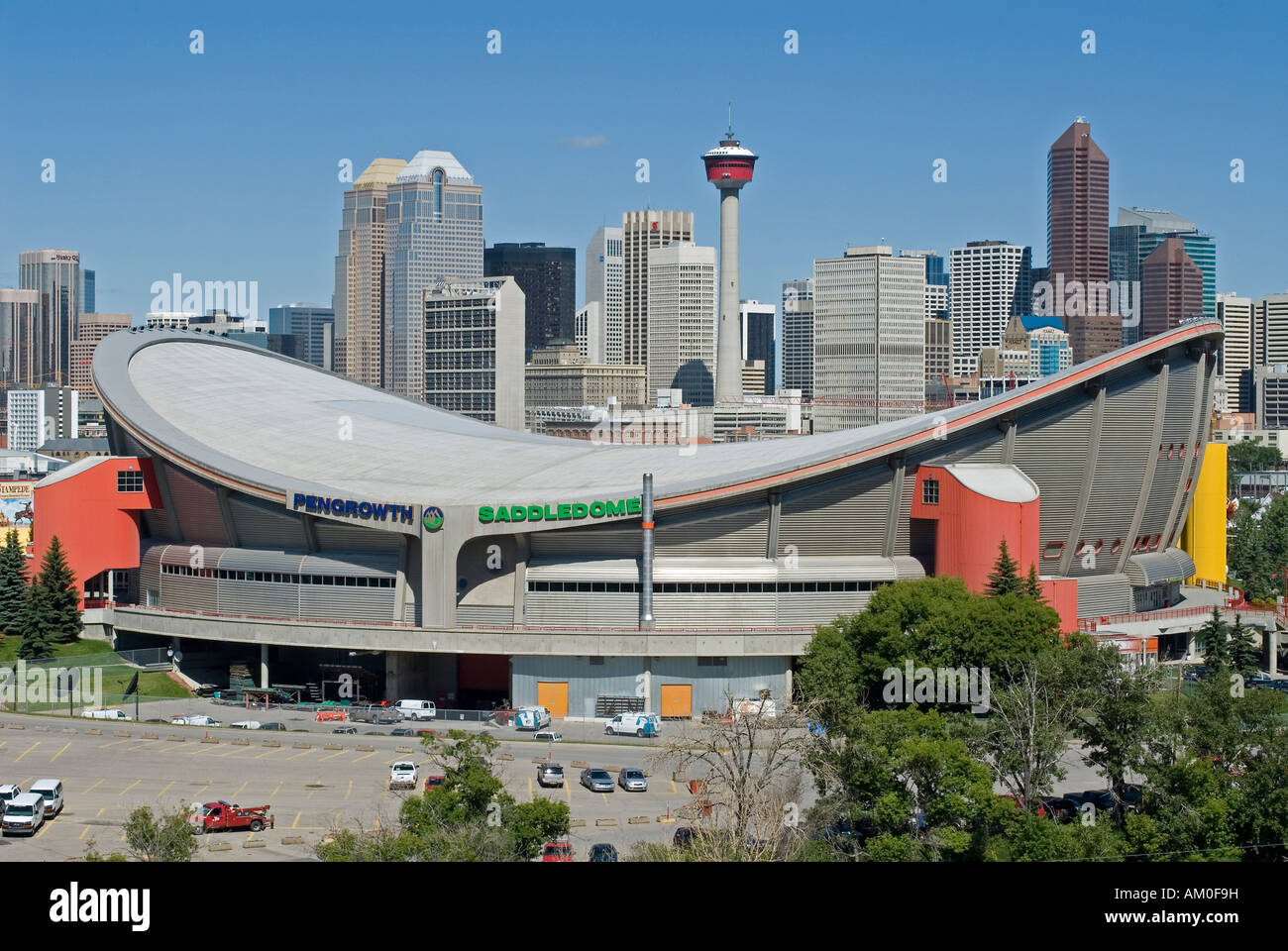 Saddledome stadium, Downtown Calgary and Calgary Tower, Alberta, Canada Stock Photo