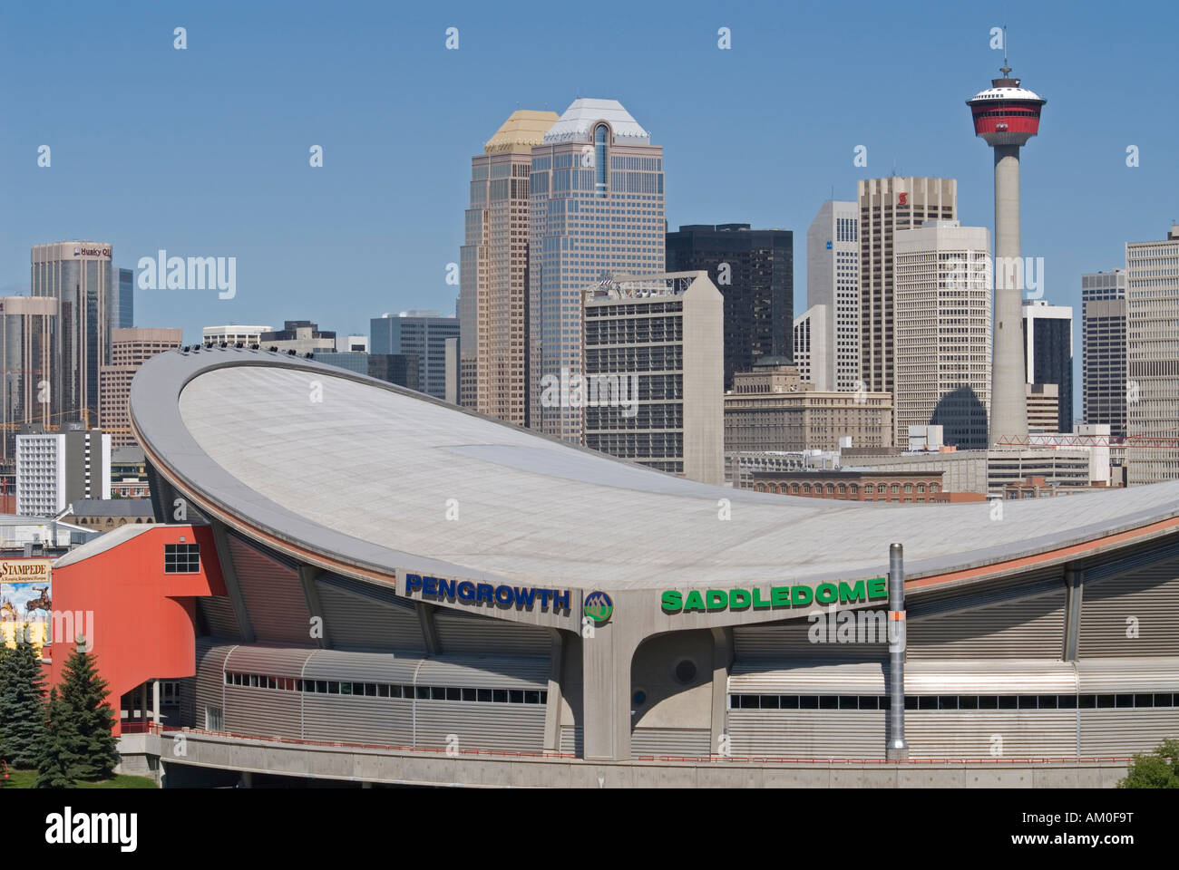 Saddledome stadium, Downtown Calgary and Calgary Tower, Alberta, Canada Stock Photo