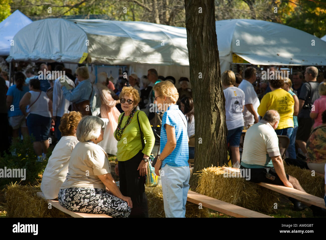 ILLINOIS Galena Four women sit and chat at Country Fair annual