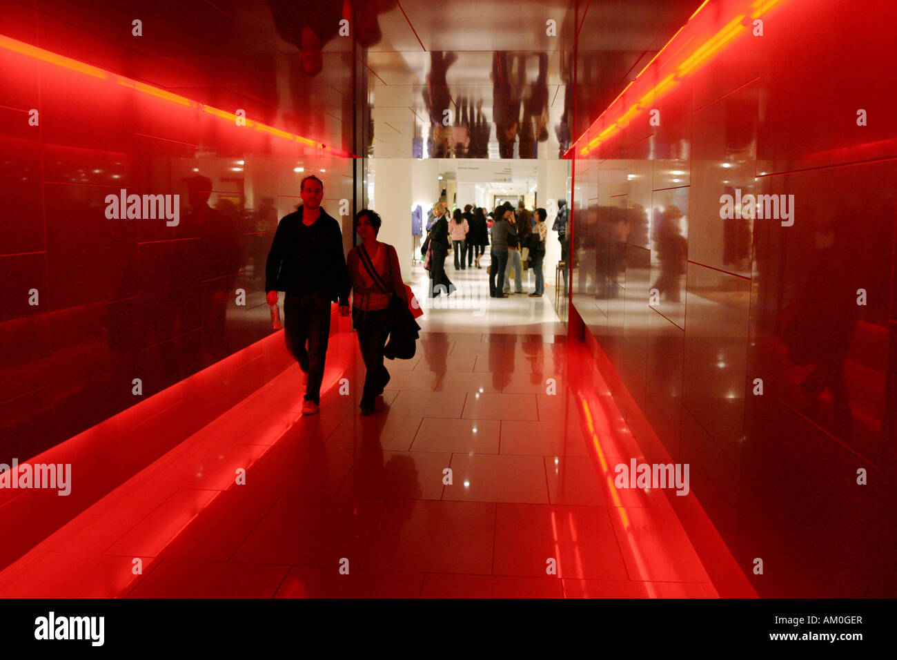 People walking through a tunnel, Selfridges, Department store, london, UK Stock Photo