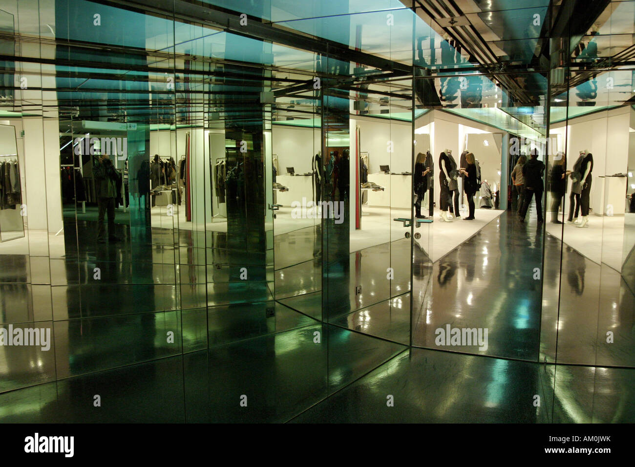 People reflected many times in mirrors in Selfridges department store