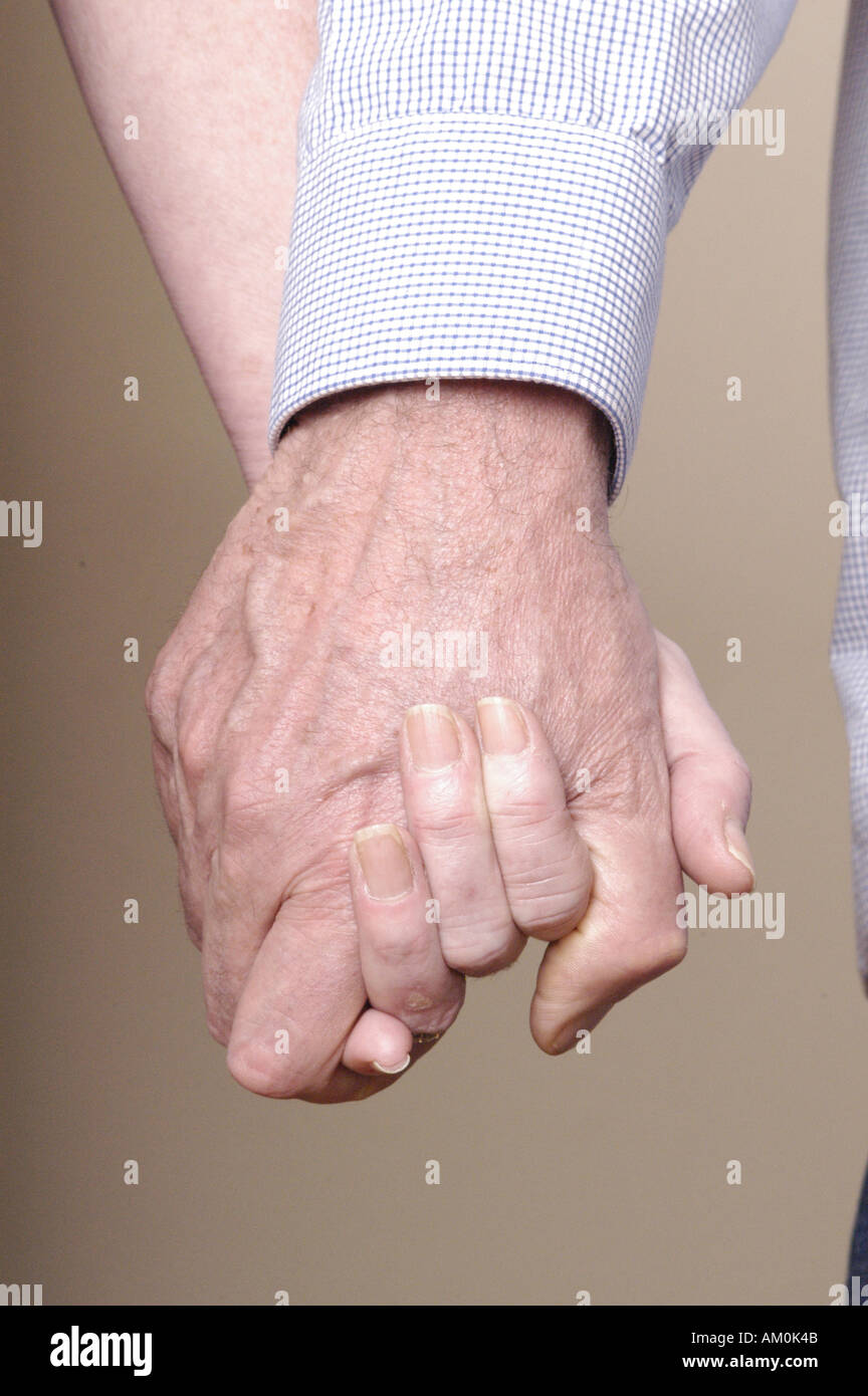 hands holding hands couple partners love relationships sex sexual anniversary partnership husband wife married wed Stock Photo photo