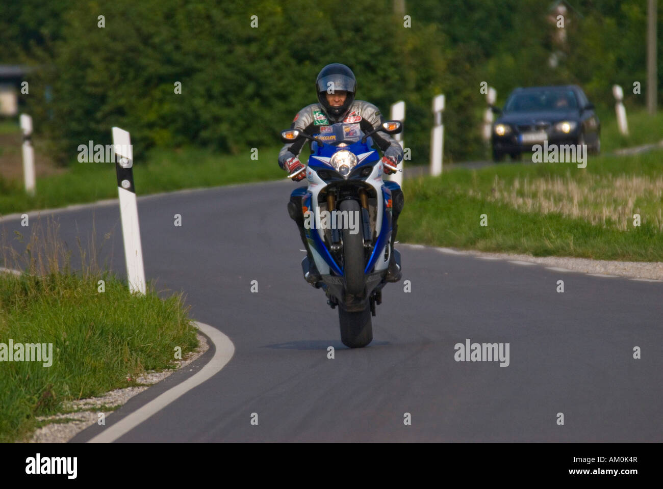 Biker making a wheely Stock Photo