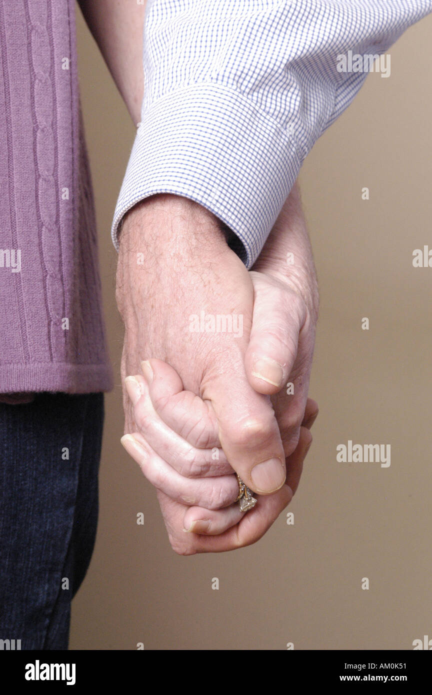 hands holding hands couple partners love relationships sex sexual anniversary partnership husband wife married wed Stock Photo photo