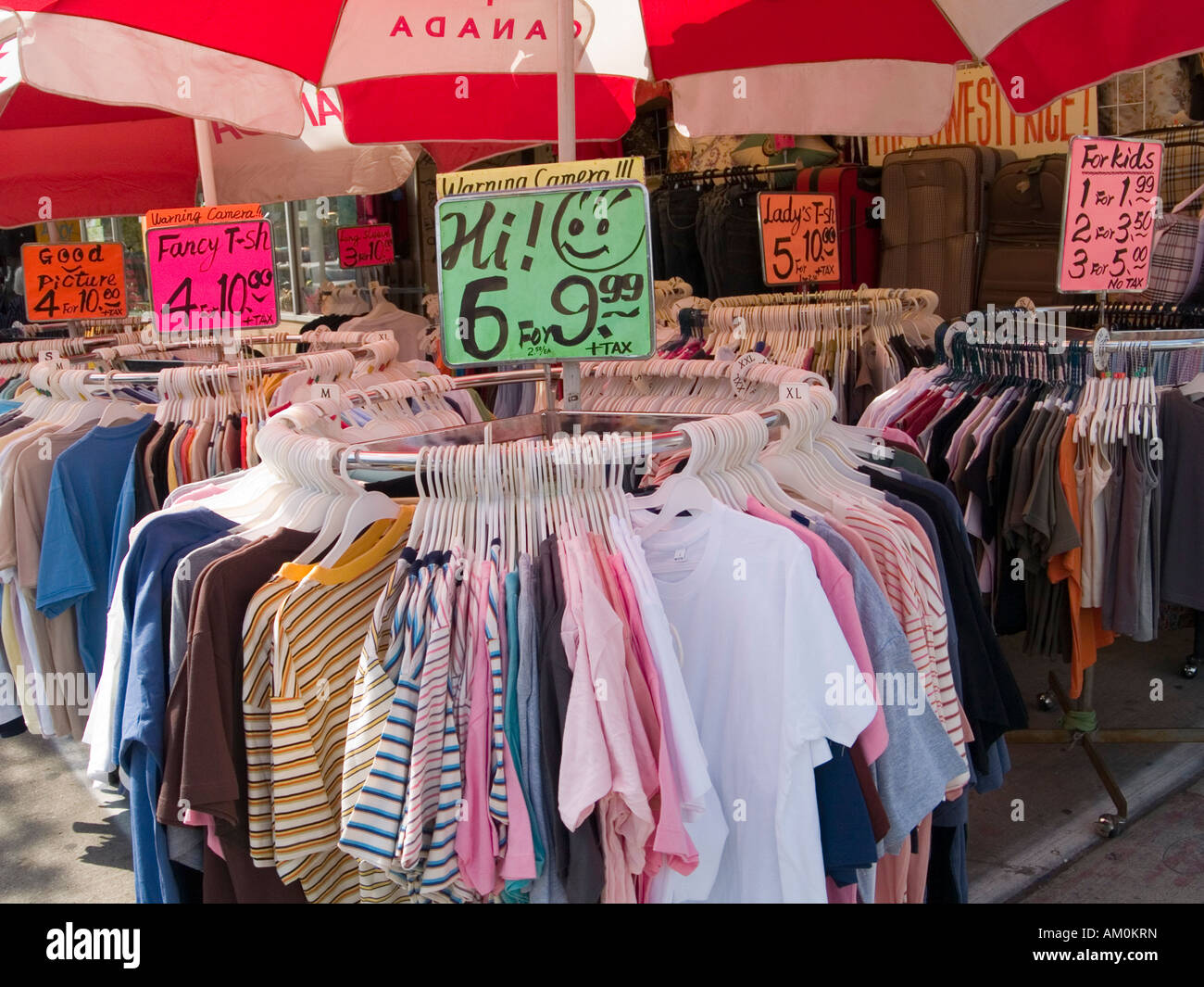 Cheap t-shirts for sale outside a clothing store in the Kensington area of  Toronto City Centre, Ontario Canada Stock Photo - Alamy