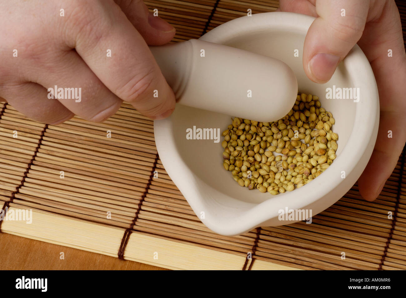 grinding coriander seeds