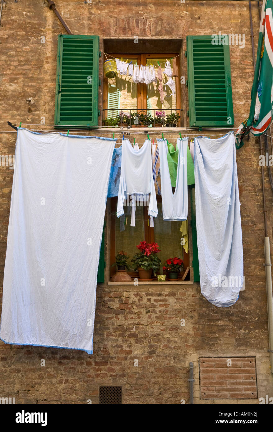 Clotheslines in front of a window hires stock photography and images