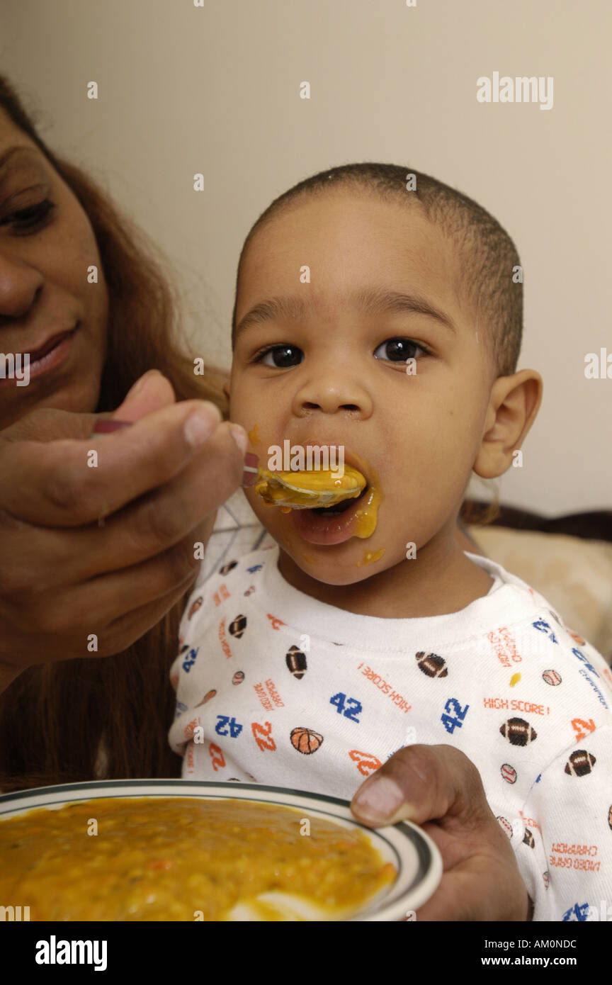 baby toddler african american baby food feed spoon fed spoon feed eat