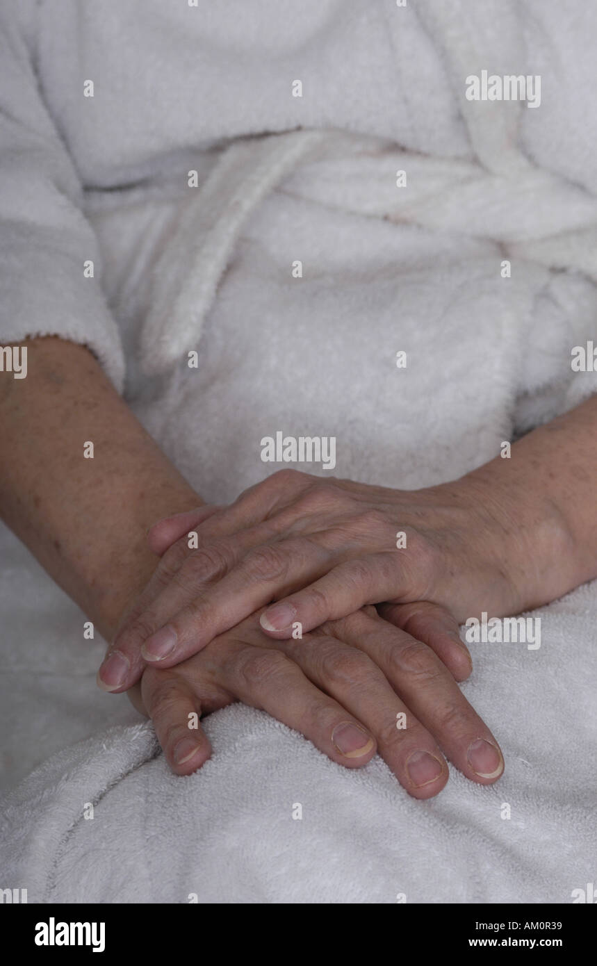 Hands lap folded hands robe dressing gown portrait Stock Photo Alamy