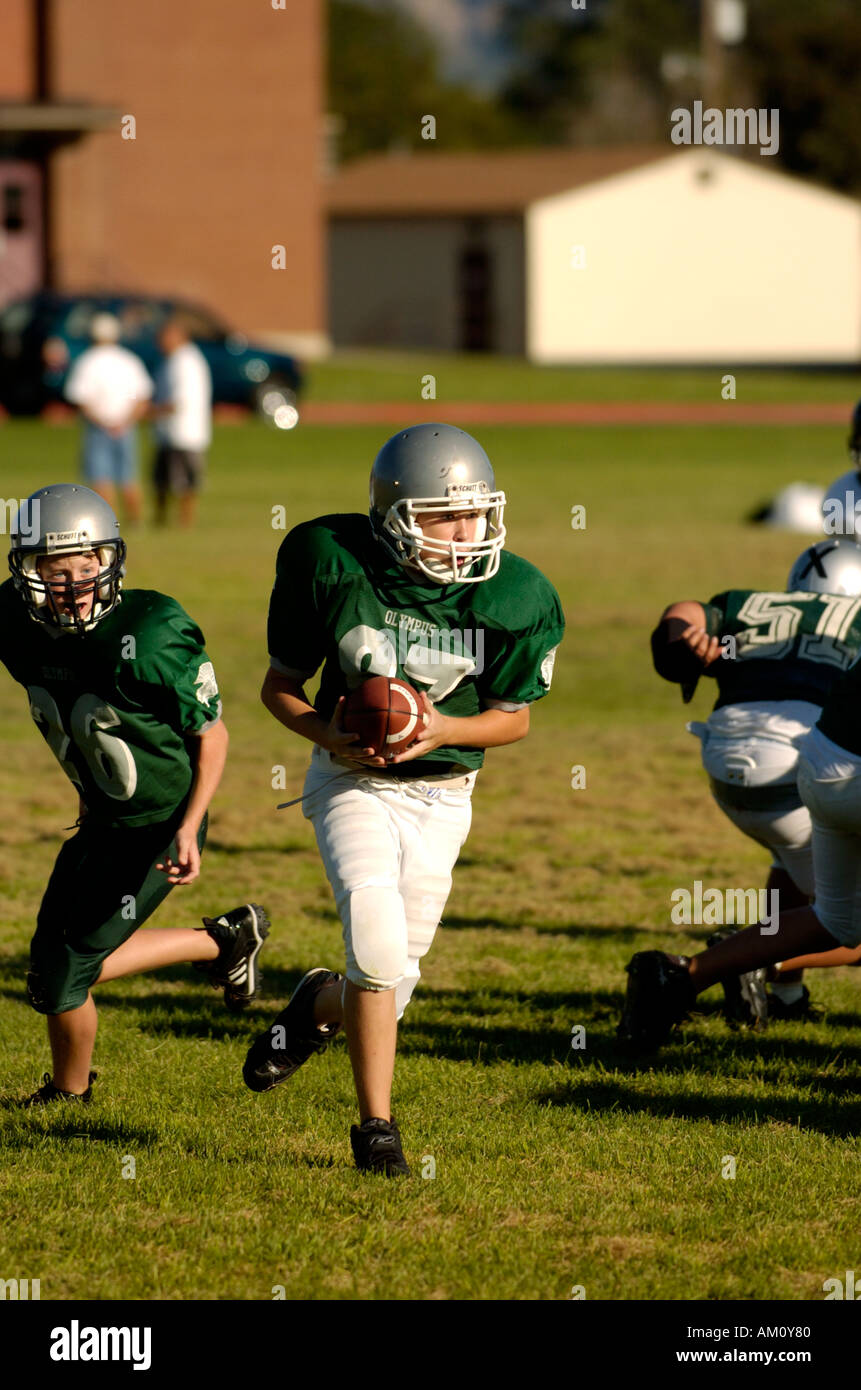 Football player running with ball Stock Photo Alamy