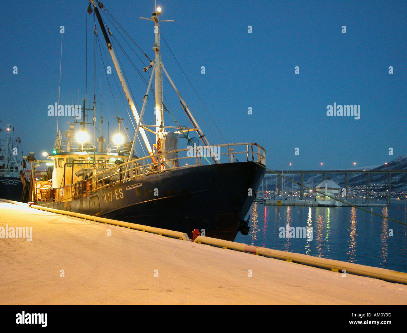 Fishing boat by the quayside in Tromso Stock Photo - Alamy
