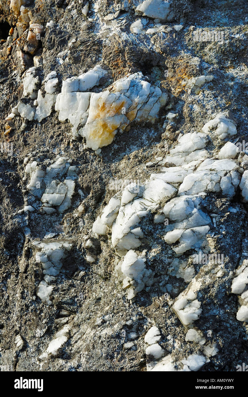 Eroded cristalline quartz vein containing metallic oxides on granite rock, Glebdalough Ireland Stock Photo