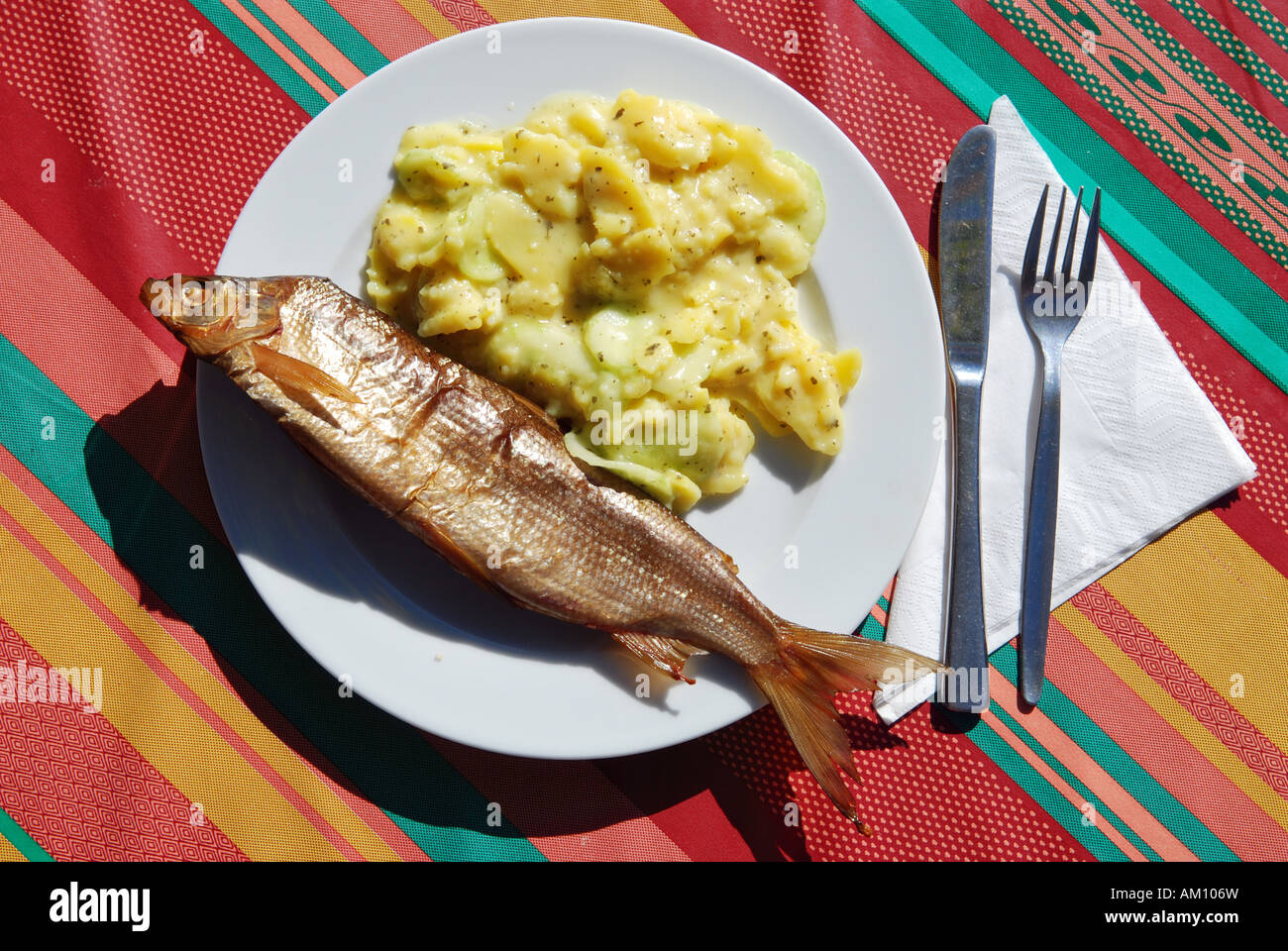 Typical meal with defumated vendace and potato salad, Fraueninsel on lake Chiemsee, Chiemgau, Upper Bavaria, Bavaria, Germany Stock Photo