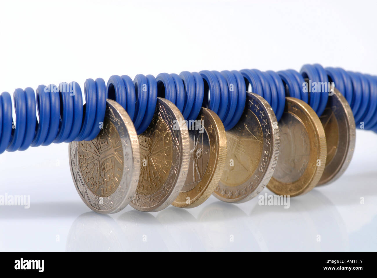 Coins, electric cable Stock Photo