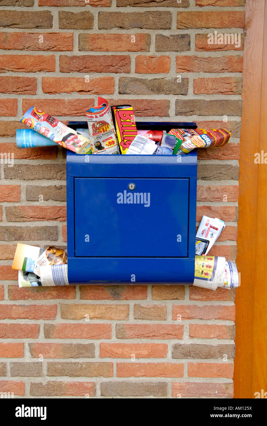 Advertising brochures in a mailbox Stock Photo