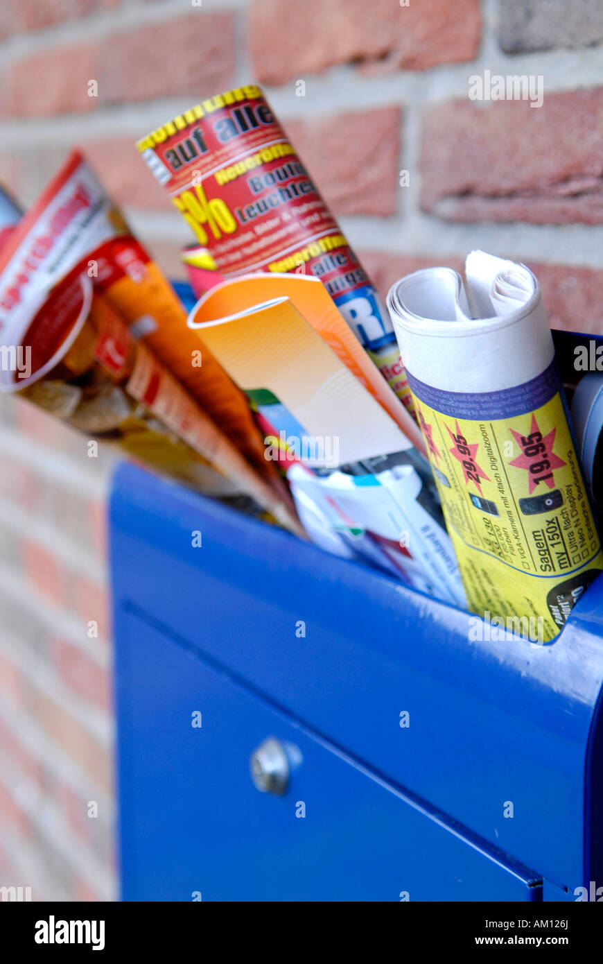 Advertising brochures in a mailbox Stock Photo