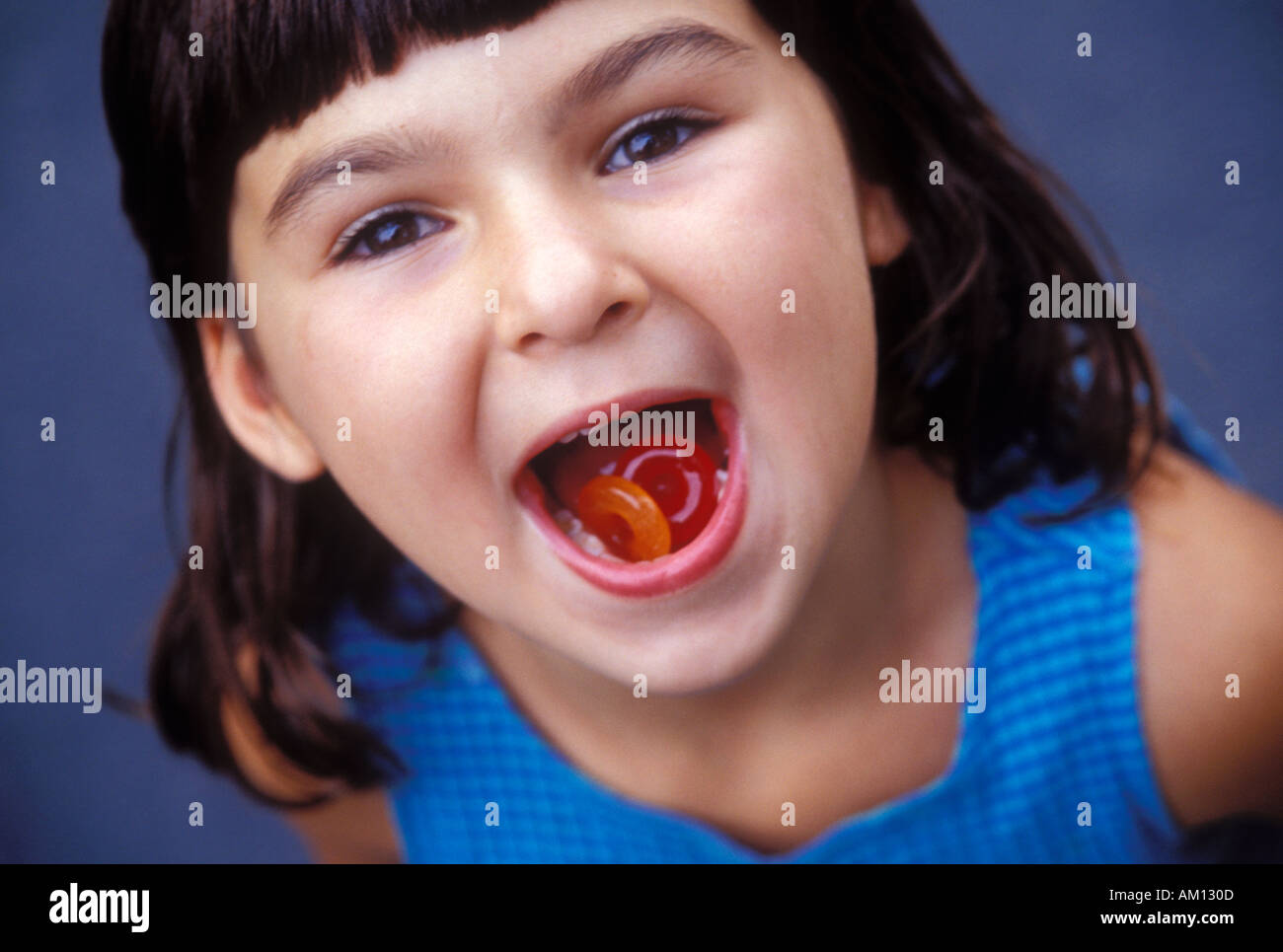 Girl With Candy in Mouth Stock Photo