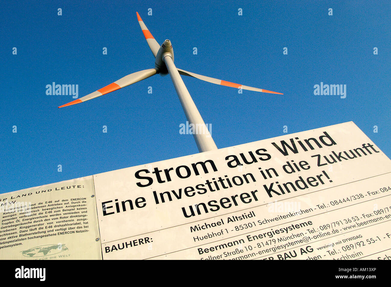 Wind energy plant Enercon E - 66, 1, 8MW, Sign: 'Energy from wind is an investment in the future of our children!', Germany Stock Photo