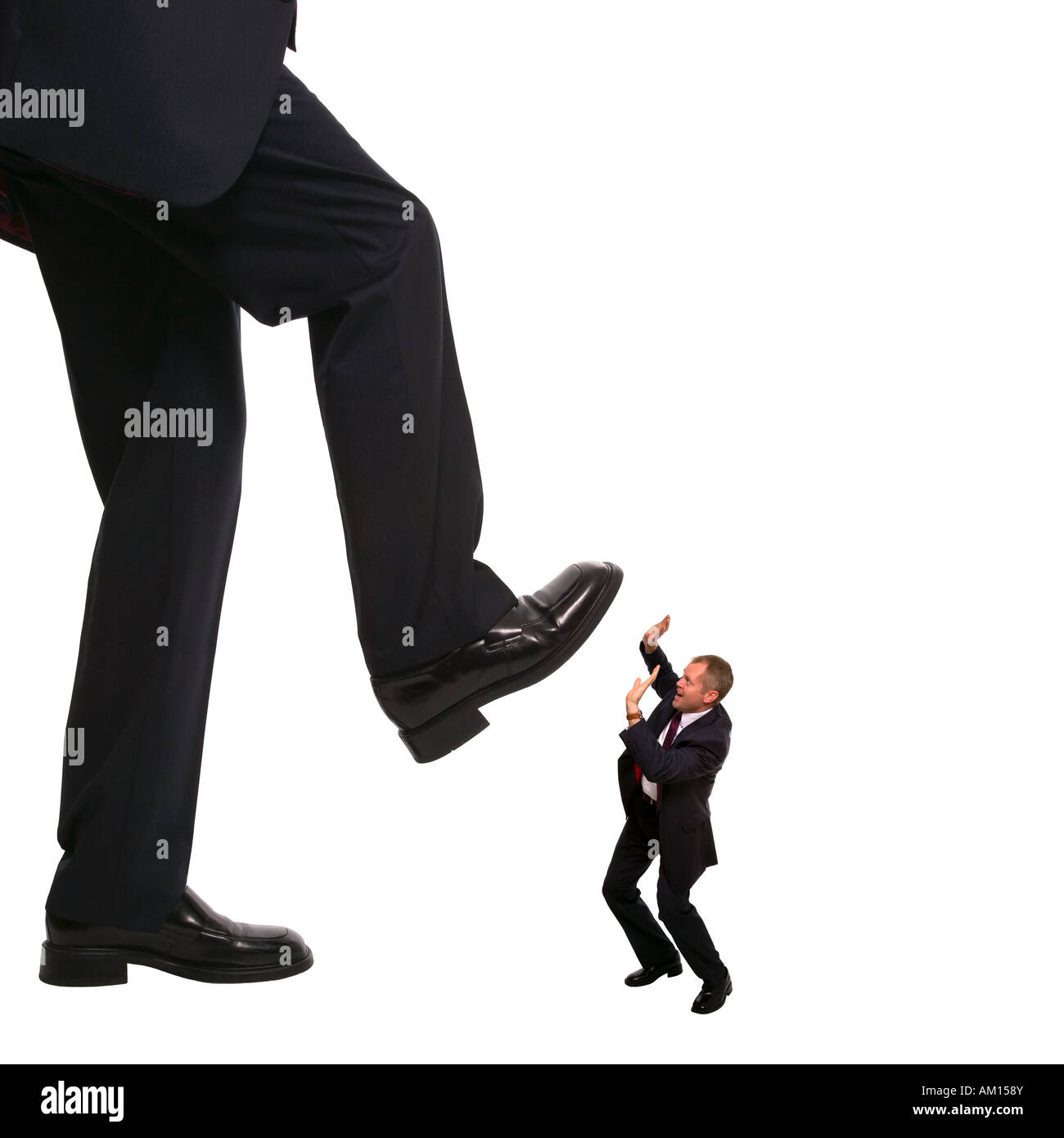 Concept image of an employee about to be stepped on by his manager Stock Photo