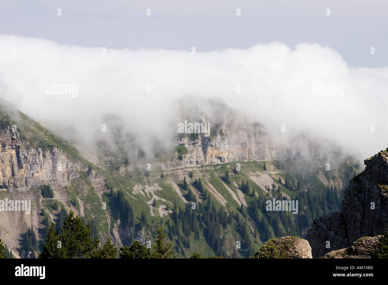 Clouds moving over a mountain crest, view from Niederhorn, Bernese Oberland, Switzerland Stock Photo