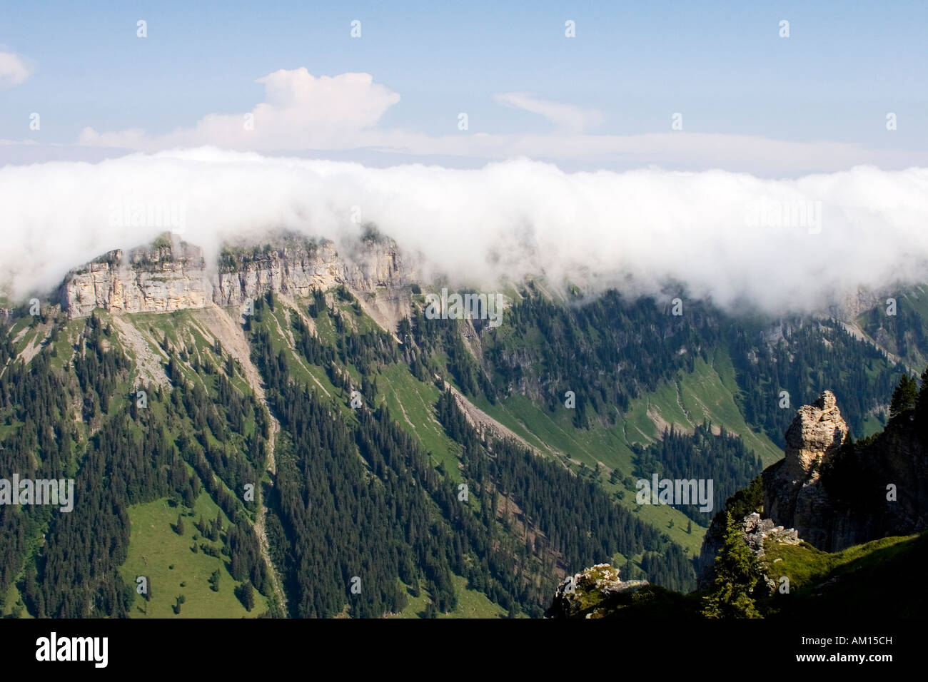 Clouds moving over a mountain crest, view from Niederhorn, Bernese Oberland, Switzerland Stock Photo