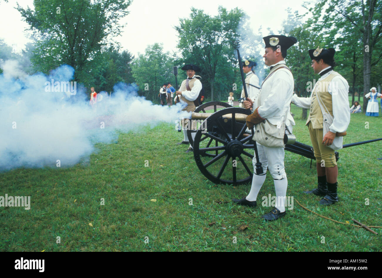 Firing cannons during Historical Revolutionary war reenactment Daniel Boone Homestead Continental Army artillery division Stock Photo