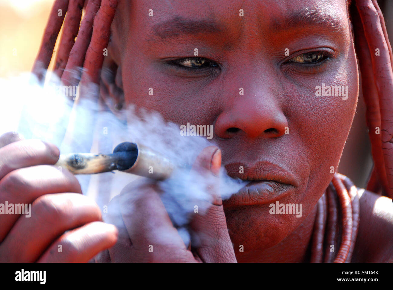 Smoking Himba women, Purros, Kaokoveld, Namibia Stock Photo