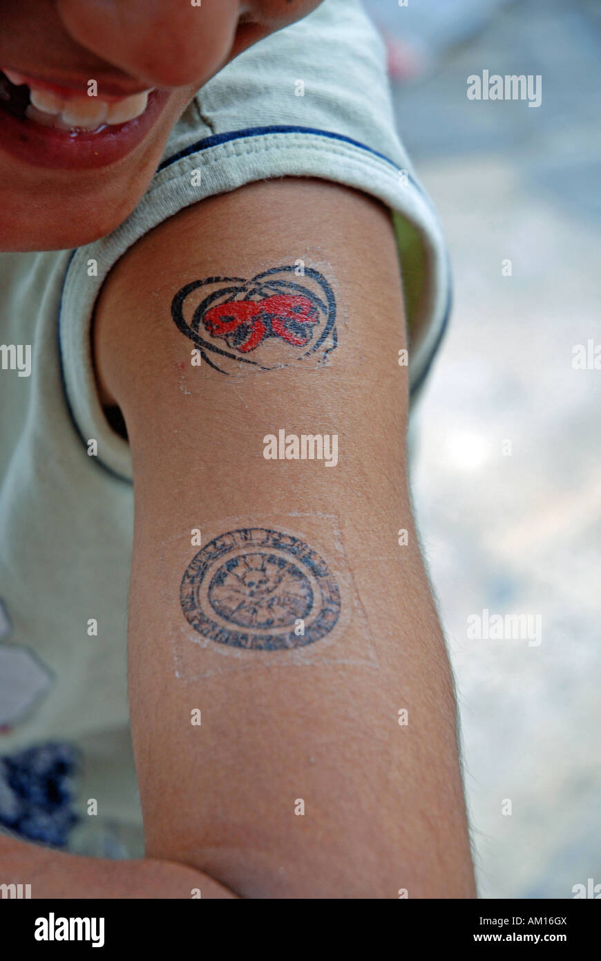 False tattoos on the upper arm of a boy, Urfa, Anatolia, Turkey Stock Photo
