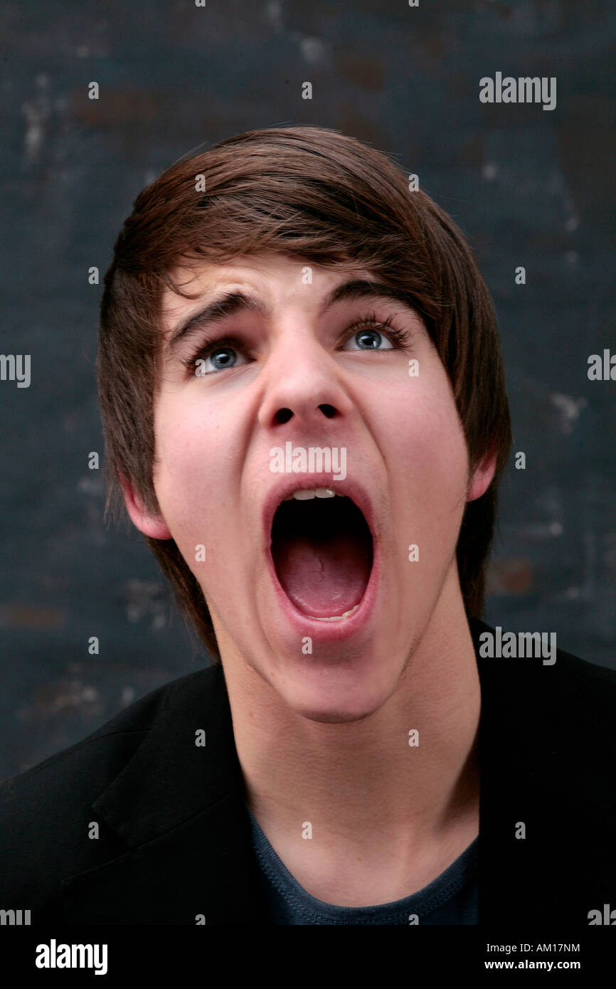 Young man screaming with mouth wide open Stock Photo