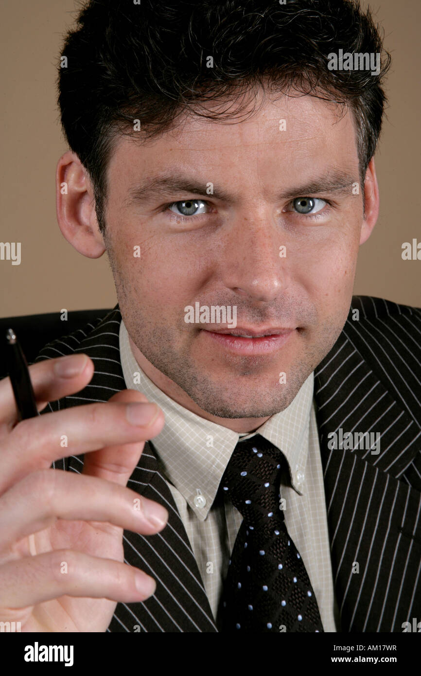 Man with ball pen Stock Photo