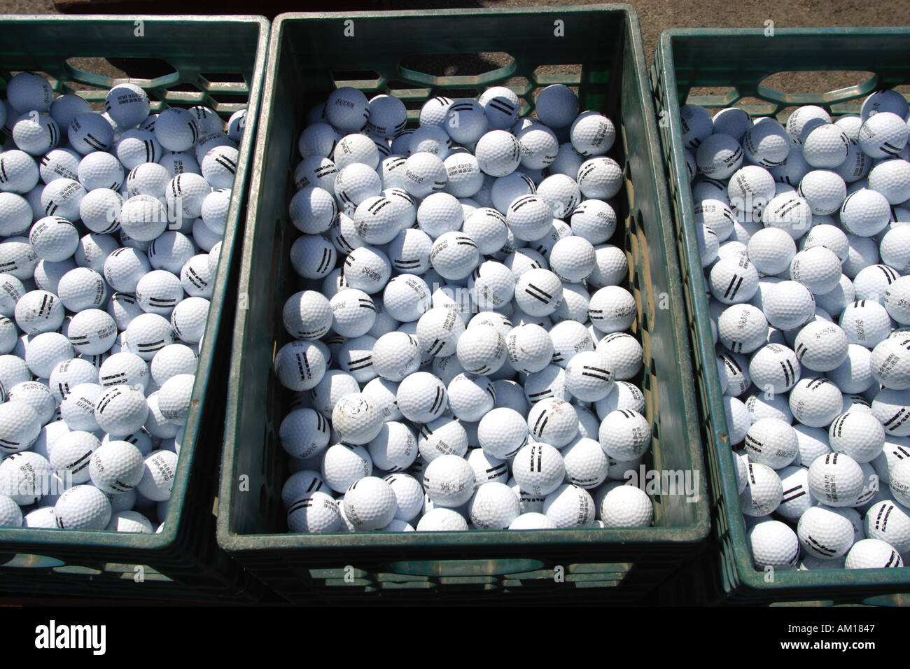 Bucket of Golf Balls at Practice Range Stock Photo - Alamy