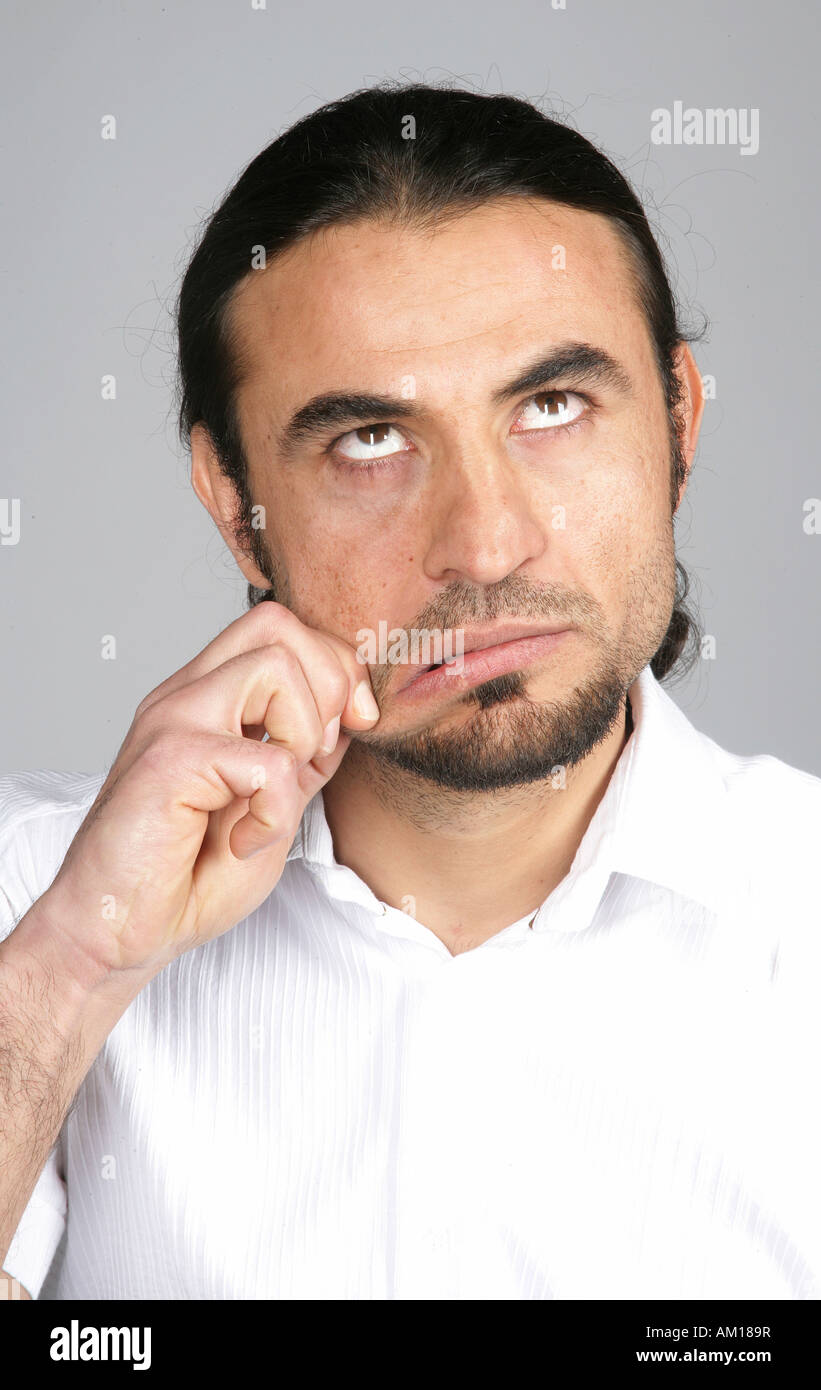 Portrait of a man, rolling his eyes, grimace Stock Photo